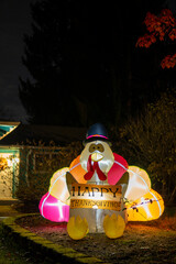 Glowing outdoor inflatable turkey figure in the hat with inscription - Happy Thanksgiving