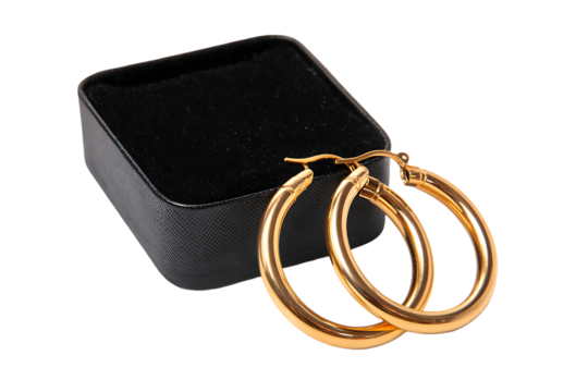 Elegant gold hoop earrings displayed on a black jewelry box