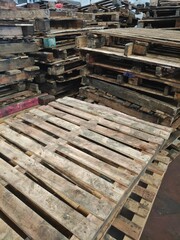 Wooden Pallets Stacked in Warehouse Storage Area