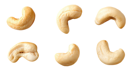 Six tan cashew nuts arranged in two rows against a black backdrop