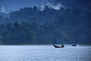 Obraz premium Surat Thani, Thailand- 21 October 2012: A modified long-tail boat for taking tourists to see the beauty in Khao Sok National Park. Ratchaprapha Dam