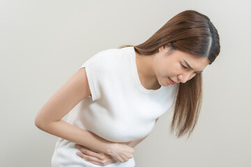 Flatulence asian young woman intolerance hand in stomach ache, suffer from food poisoning,...