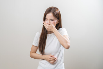 Unhappy pregnant asian young woman, pain girl suffering from nausea, having vomit feeling sick,...