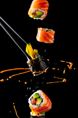Sushi food rolls with fish, shrimp with chopsticks