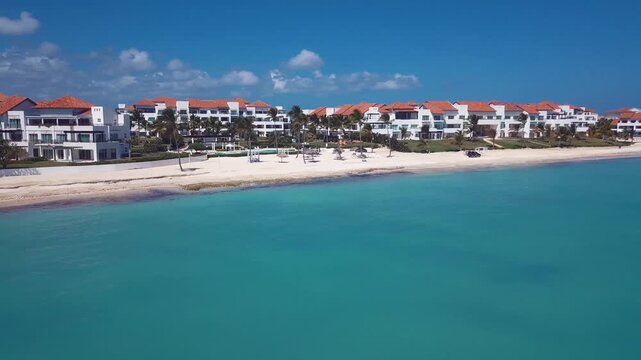 caribbean beach with hotel in the paradise with palms tree 4k 24fps