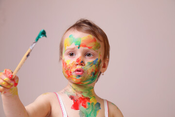 Child embracing creative chaos as part of learning. Copy space.