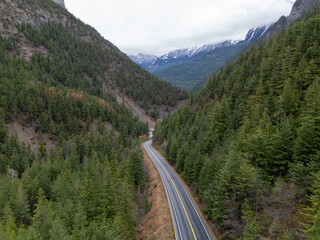 Winding Mountain Road Through Dense Forest in BC, Canada Landscape