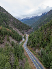 Winding Mountain Road Through Dense Forest in BC, Canada Landscape