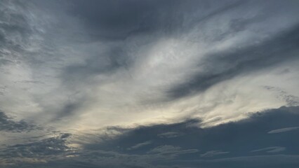 Obraz premium Dramatic sky with thick bluish-grey clouds forming a dynamic texture.