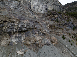 Rugged Rocky Cliff and Sloping Scree Landscape in British Columbia, Canada, Steep Gray Rocks Terrain