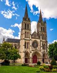 Fototapeta premium Majestic, tall cathedral with two spires under a cloudy sky
