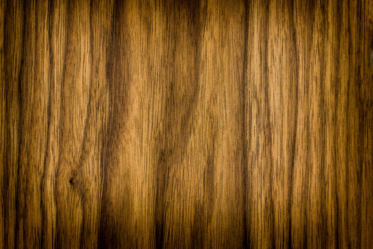 the texture of natural wood. wooden dark brown board. the panel is made of natural wood. american valnut, frame, place for text or object, vignetting, horizontal