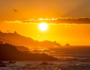 Golden sunrise casts glow over coastline, with a solitary bird in flight overhead