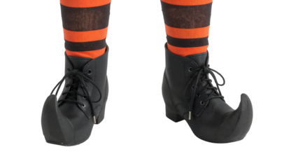 Halloween witch costume boots with curled toes and orange black striped socks isolated on the transparent background