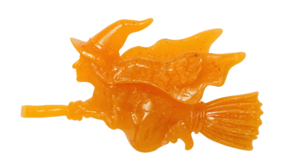 Halloween witch gummy candy on broomstick isolated on the transparent background, festive orange sweet treat for fall and holiday celebrations