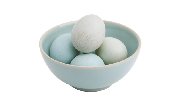Pastel blue and green eggs arranged in minimalist ceramic bowl on the transparent background for modern kitchen or easter themes