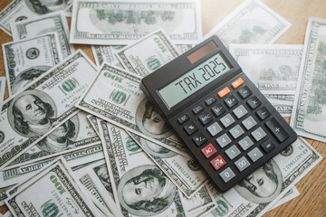 Fototapeta premium Calculator with tax calculator, investment report analysis, annual tax reduction planning ideas, financial and tax system.