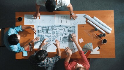 Top down aerial view of professional project manager planing house design by using plan. Aerial...