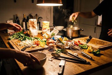 Messy Kitchen Counter with Raw Ingredients and Scattered Vegetables, Dynamic Rushed Cooking Preparation