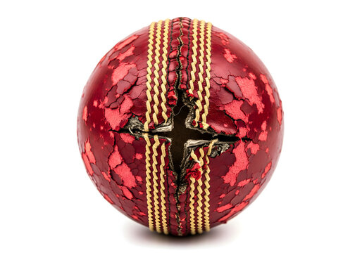 Damaged red cricket ball with torn seam and cracked leather, isolated on white background, representing intense gameplay, sports wear and tear, cricket equipment and competitive match concept - Powered by Adobe