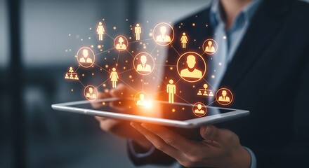 Person holding tablet with glowing network of people icons