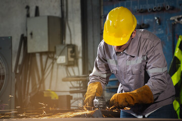 Factory welder in protective gear grinds metal with angle tool, focused worker creates bright sparks in industrial workshop environment under warm light, craftsmanship and safety guide precise work