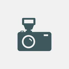 Flat design camera with flash icon, a simple pictogram representing digital photography and the art of capturing moments. Vector graphic for web and mobile use