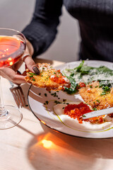 Brunch scene with crispy fritter and red caviar