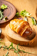 Golden baked croissant roll