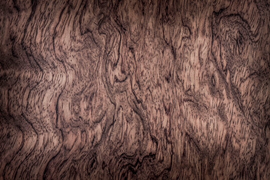 background is made of old wood. an old board. the texture of a rustic table. bubinga, essingang, ebana, kevazingo, akume, waka, a place for a text or object, frame. the effect of aging, horizontal