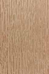 texture of valuable wood. wooden creme board. lumber. koto, African, Pterygota, view from above. vertical texture