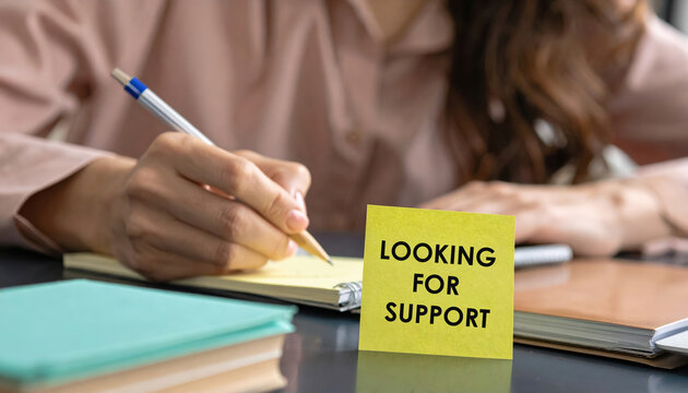 Woman looking for support writes note about difficult labor market. concept of job shortages and career anxiety highlights need for help and professional guidance