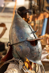 Obraz premium old medieval bascinet-type helmet popular in medieval Europe, evolving from a simple steel cap in the late 13th century