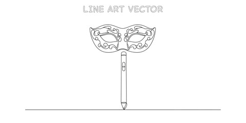 Carnival mask held up by a vertical pen or pencil stick