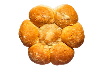 A large family bun with crumbs on a white background. Close-up of a sweet bun. Chamomile bun
