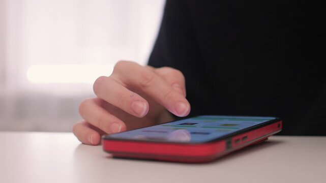 Nightly hand gestures on smartphone, Fingers tapping and engaging with phone during night hours, Closeup shot capturing hand movements interacting with mobile device at night
