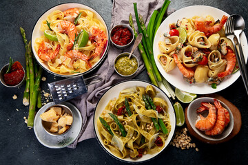 Italian dinner table with assortment of pastas.