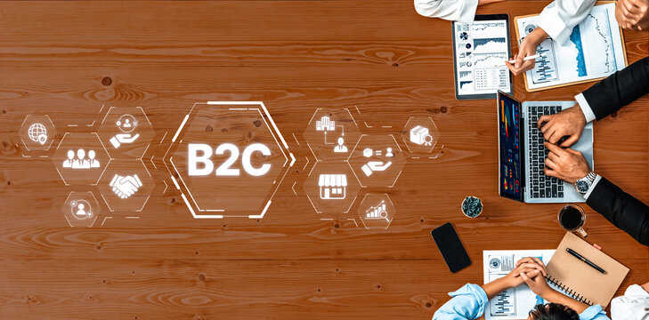 Overview of a modern B2C marketing strategy session with professionals working on laptops, discussing analytics, and using digital icons to foster collaboration in a business setting. Trope - Powered by Adobe