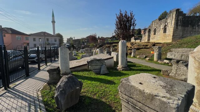 4K video of Prusias ad Hypium theater in Duzce. The ancient Roman ruins are nestled directly within the modern settlement of Konuralp, blending history with urban life.