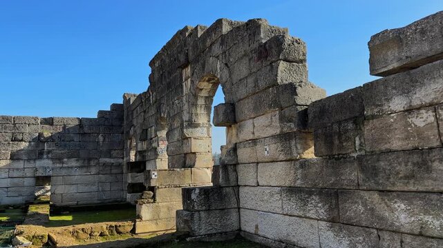 4K video of Prusias ad Hypium theater in Duzce. The ancient Roman ruins are nestled directly within the modern settlement of Konuralp, blending history with urban life.