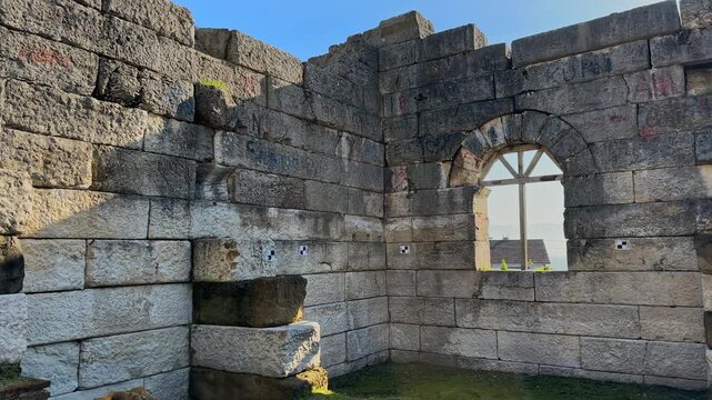 4K video of Prusias ad Hypium theater in Duzce. The ancient Roman ruins are nestled directly within the modern settlement of Konuralp, blending history with urban life.