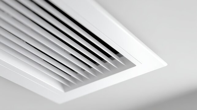 Modern white air conditioning vent on a ceiling for climate control