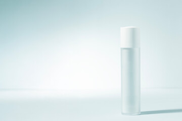 Abstract cosmetic bottle in soft natural light toned in pastel color Minimalist aesthetic perfect for representing premium skincare, facial serums, copy space