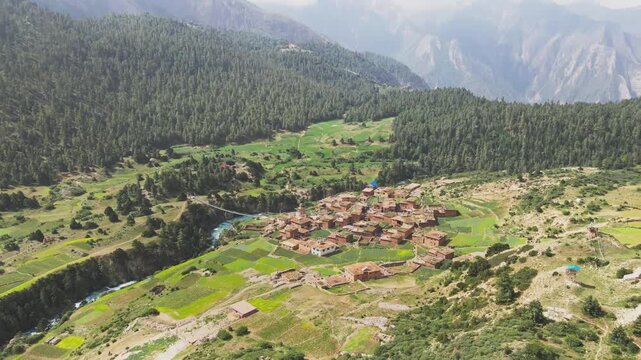 A sweeping drone shot reveals Shey Phoksundo Lake&rsquo;s village deep turquoise glow, rugged Dolpa cliffs, and untouched Himalayan wilderness.