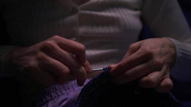 Crochet workshop scene, Artisan at work with yarn, Cozy crafting space with textured handmade stitches, Quiet studio environment dedicated to knitting and crochet crafts today