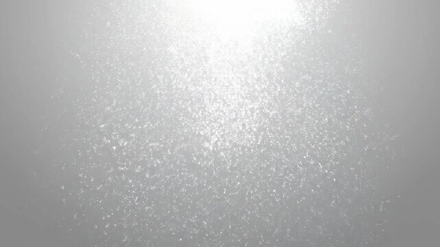 Seamlessly looping abstract background motion graphic featuring tiny digital white noise particles slowly dissolving into a perfectly clean light gray field clean, matrix, motion graphics