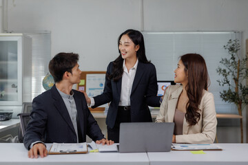 Female leader inspiring business team collaboration in office