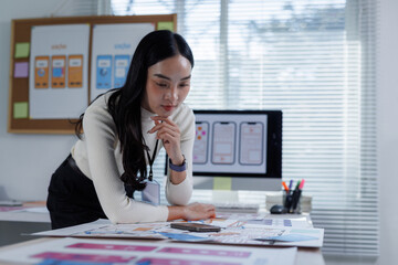 Woman designer brainstorming app user interface wireframes