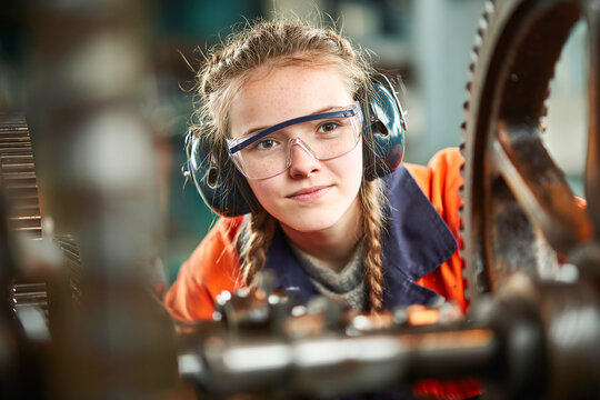 Apprentice learning gear machining skills in a workshop setting Generative AI