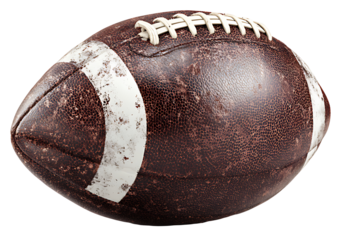 A vintage worn leather american football isolated on a black background